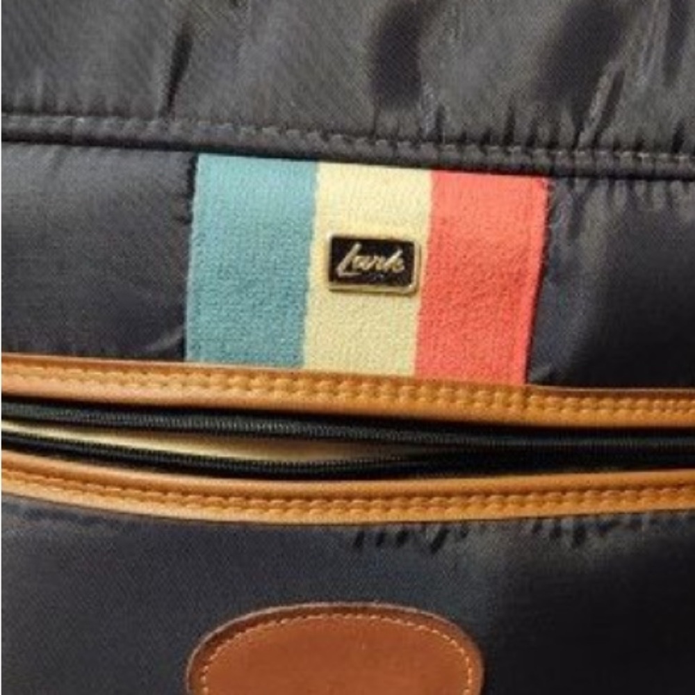 Luxurious Black and Brown Travel Bag with Multicolor Accents